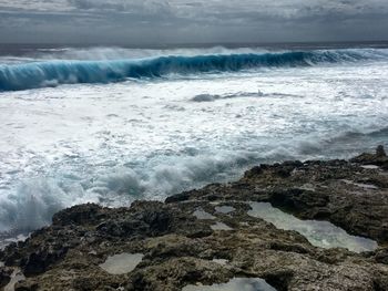 Waves breaking on rocks