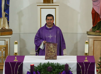 Full length of man standing on table