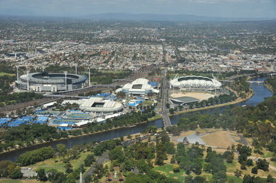 High angle view of buildings and trees in city