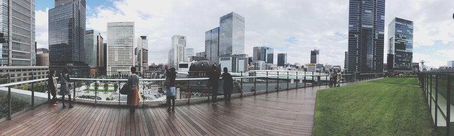 Panoramic view of modern buildings in city against sky