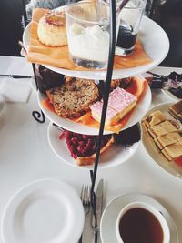 High angle view of desserts on cakestand at table