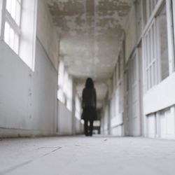 Woman standing in front of building