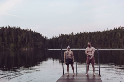 Men standing on jetty