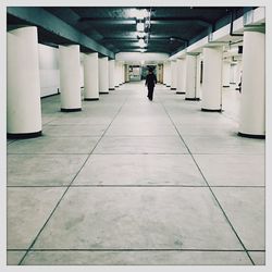 People walking on escalator in subway