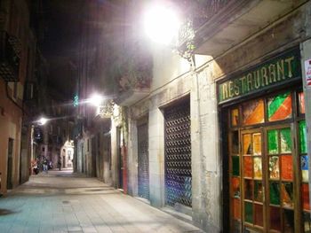 Illuminated buildings in city at night