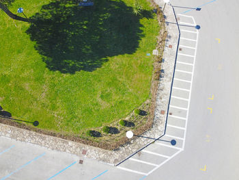 High angle view of road amidst trees in city