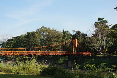 Bridge over river against sky