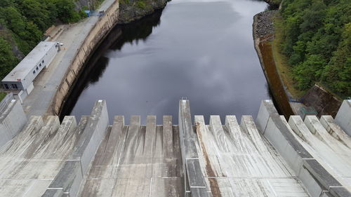 High angle view of dam by lake