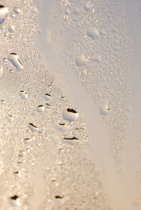 Full frame shot of raindrops on glass window