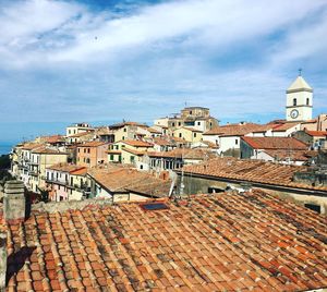High angle view of buildings in city against sky