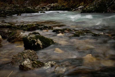 Stream flowing through rocks in sea