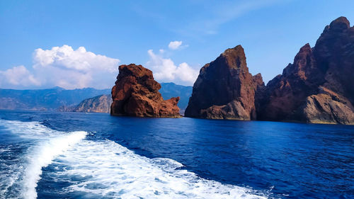 Panoramic view of sea and rock formation against sky