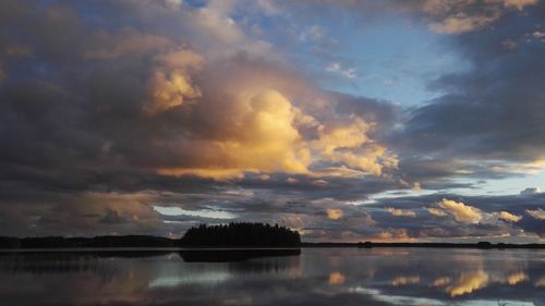 Scenic view of lake against sky during sunset