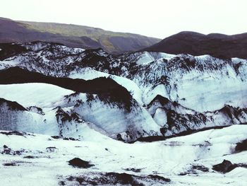 Scenic view of snow mountains against sky