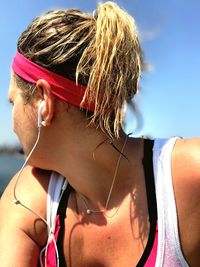 Close-up of woman wearing in-ear headphones