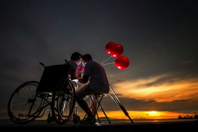 Couple on date at beach during sunset