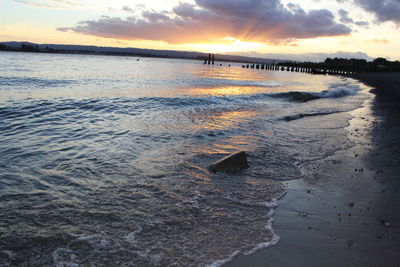 Scenic view of sea against sky at sunset