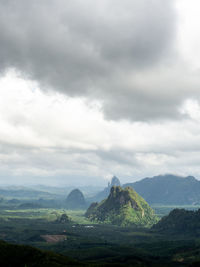 Beautiful landscape of mountain with cloudy sky and greenery in rainy season.