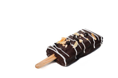 Close-up of chocolate cake against white background