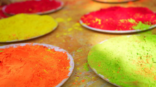 Colorful traditional holi powder in bowls  happy holi concept indian color festival called holi