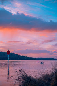 Scenic view of beach against sky during sunset