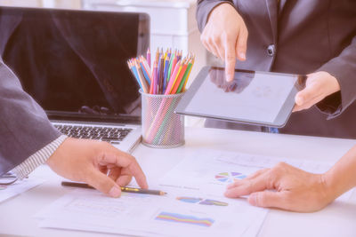 Low section of woman working on table