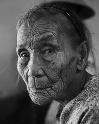 Close-up portrait of woman looking away