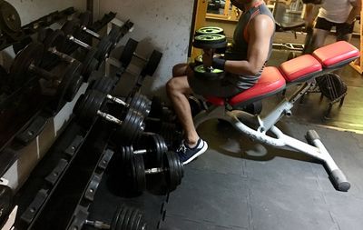 Low section of man sitting on floor