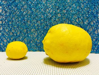 Close-up of lemons on wooden table
