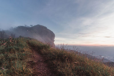 Scenic view of land against sky during sunset