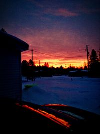 Silhouette of house at sunset
