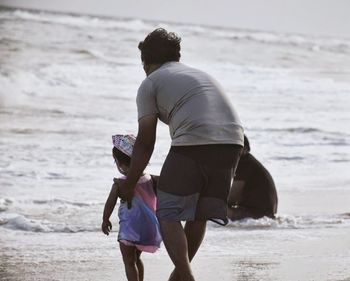 Man with child at beach