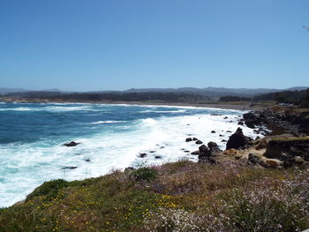 Scenic view of sea against clear sky