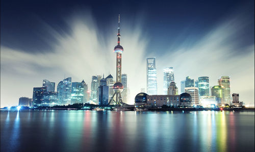 City lit up at waterfront