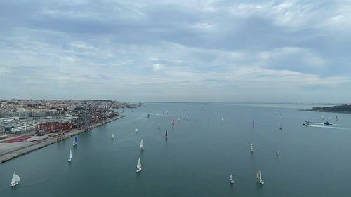 High angle view of crowd by sea against sky