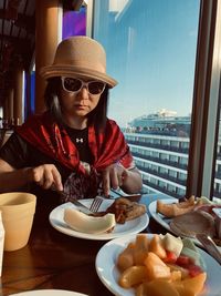 Portrait of woman sitting in restaurant