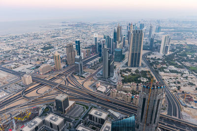 High angle view of illuminated city against sky