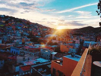 High angle view of townscape against sky at sunset