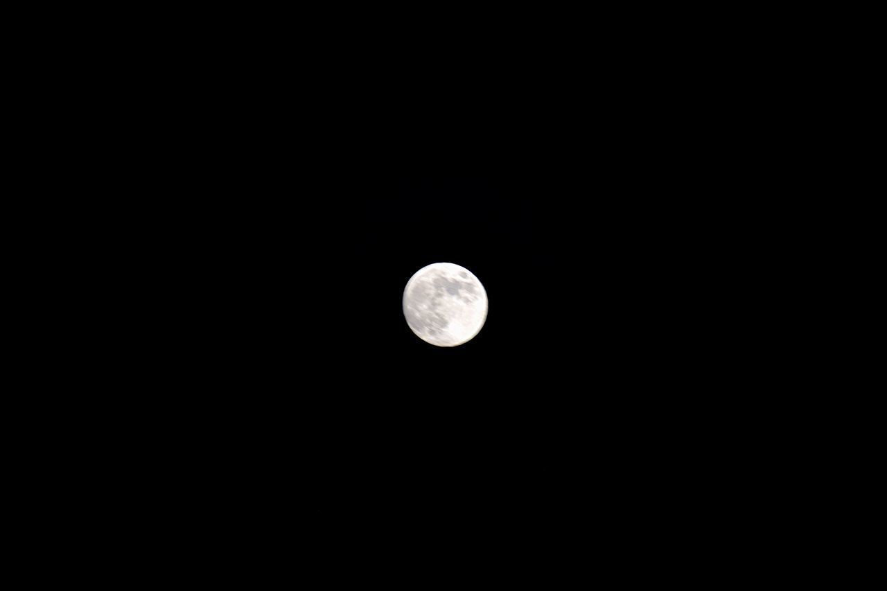 LOW ANGLE VIEW OF MOON AGAINST DARK SKY