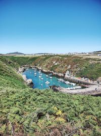 Scenic view of sea against clear blue sky