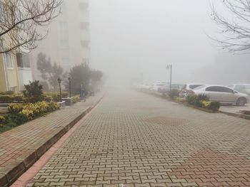 Street in city against sky