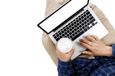 Low angle view of man using laptop on table