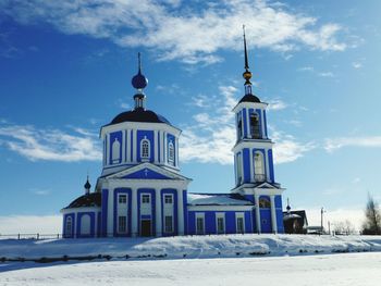 High angle view of church against blue sky