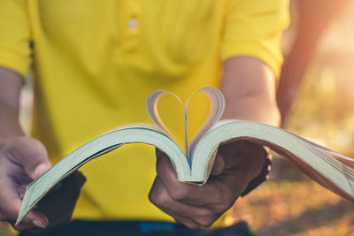 Close-up of man holding heart shape