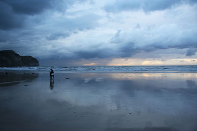 Scenic view of sea against cloudy sky