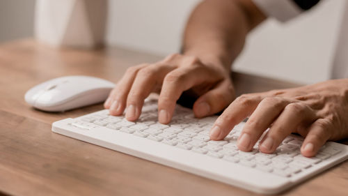 Men are using computer for social media and online marketing including working from home