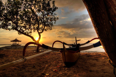 Scenic view of beach against sky during sunset