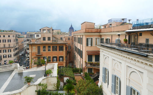 Buildings in city against sky