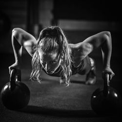 Young woman exercising at gym