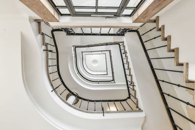 Directly below shot of spiral staircase of building